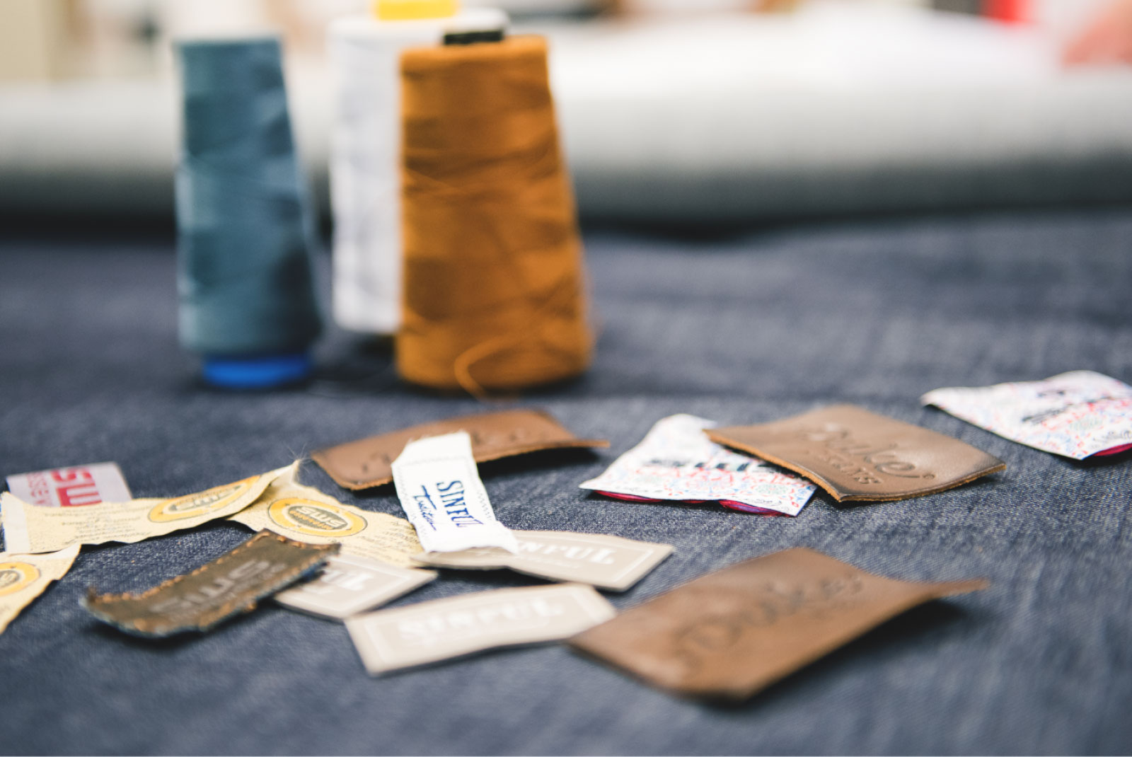 Artisanal textile labels and threads showcasing Daritex's attention to detail and heritage craftsmanship